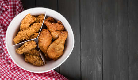 top view fried chicken bucket with copy space kitchen towel. Resolution and high quality beautiful...