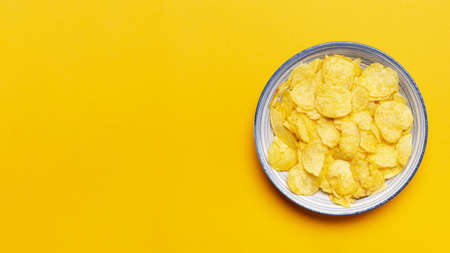 top view chips bowl yellow background. Resolution and high quality beautiful photo