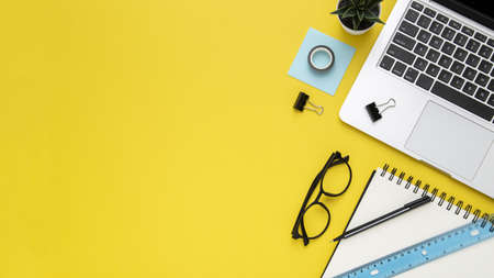 stationery arrangement yellow background with copy space.の写真素材