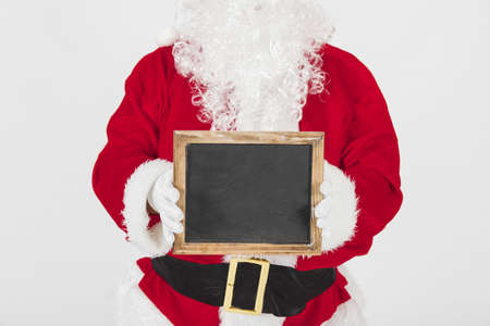 santa claus showing empty wooden frame. Resolution and high quality beautiful photoの写真素材