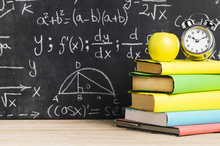 school desk with textbooks near blackboard. Resolution and high quality beautiful photo