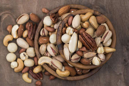 pile bowls filled with organic nuts top view. Resolution and high quality beautiful photo