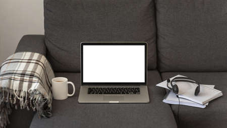laptop headset home sofa during quarantine. Resolution and high quality beautiful photoの写真素材