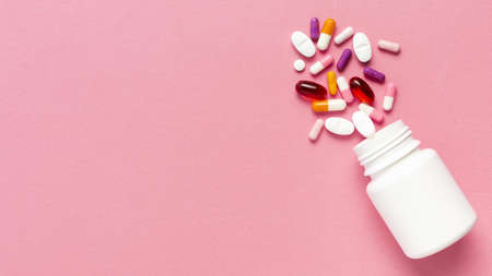 pills bottle pink background. Resolution and high quality beautiful photoの写真素材