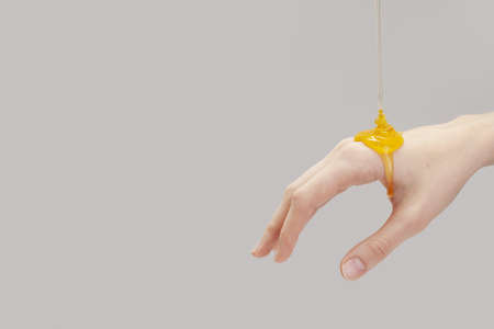 organic honey pouring hand. Resolution and high quality beautiful photoの写真素材