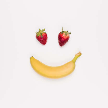red strawberry yellow banana white background. Resolution and high quality beautiful photoの写真素材
