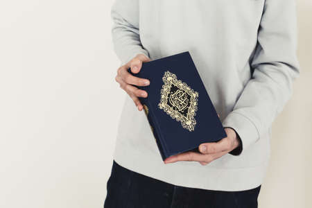 ramadan concept with man holding quran. Resolution and high quality beautiful photoの写真素材