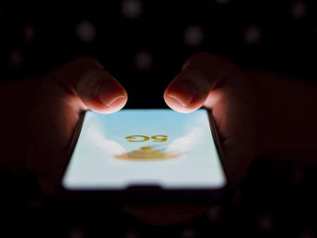 person holding phone hands dark background. Resolution and high quality beautiful photoの写真素材