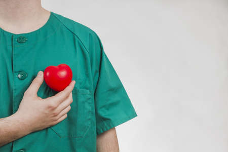 nurse showing plastic heart. Resolution and high quality beautiful photoの写真素材