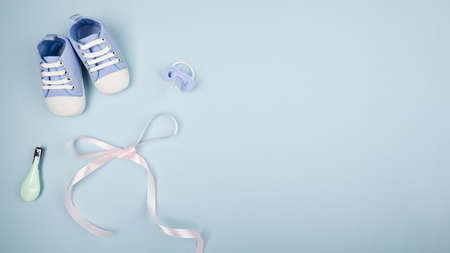 ribbon with baby shoes copy space. Resolution and high quality beautiful photoの写真素材