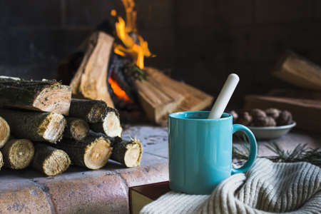 mug blanket near fireplace. Resolution and high quality beautiful photoの写真素材