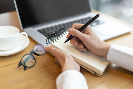 modern female writing notepad. Resolution and high quality beautiful photoの写真素材