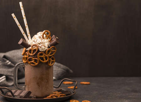 front view chocolate milkshake with straws pretzels. Resolution and high quality beautiful photoの写真素材
