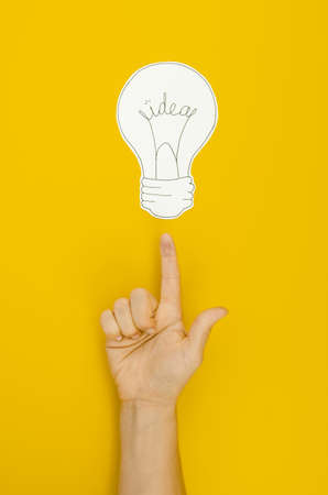 hand pointing lighten bulb. Resolution and high quality beautiful photoの写真素材