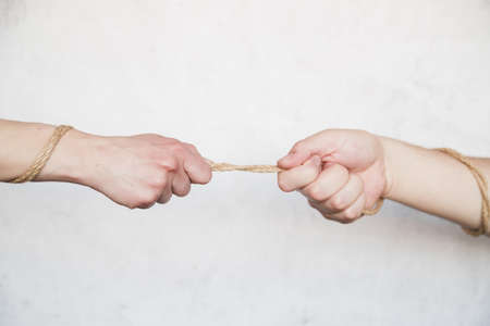 hands pulling rope. Resolution and high quality beautiful photoの写真素材