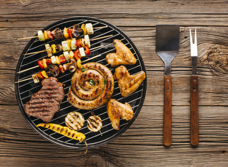 high angle view delicious grilled meat with vegetable coals barbecue. Resolution and high quality beautiful photoの写真素材