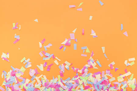 colorful confetti orange background. Resolution and high quality beautiful photoの写真素材
