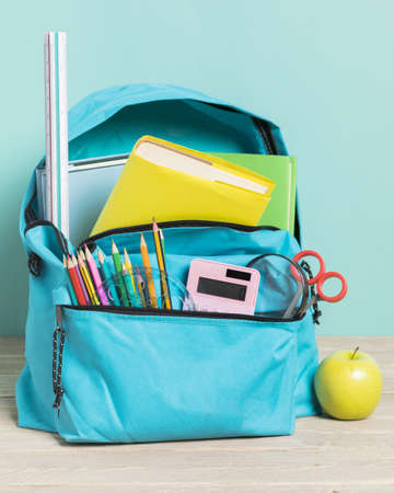 blue school bag with essential supplies. Resolution and high quality beautiful photo