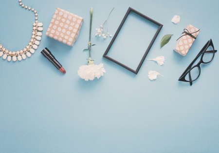 blank frame with flowers gift boxes lipstick table. Resolution and high quality beautiful photoの写真素材
