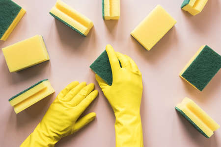 close up person with yellow gloves sponges. Resolution and high quality beautiful photo