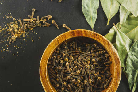 bay leaves near bowl with cloves. Resolution and high quality beautiful photoの写真素材