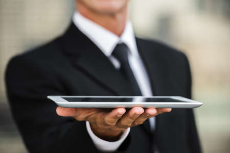 close up businessman holding tablet hand. Resolution and high quality beautiful photoの写真素材
