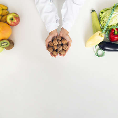 close up person with vegetables holding nuts. Resolution and high quality beautiful photoの写真素材