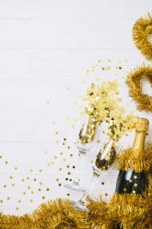 champagne bottle with tinsel table. Resolution and high quality beautiful photoの写真素材