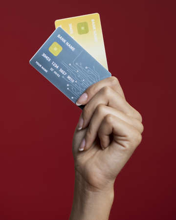 woman holding her credit cards close up. High quality beautiful photo conceptの写真素材