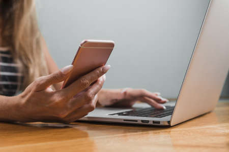 woman hands using phone laptop. High quality beautiful photo conceptの写真素材