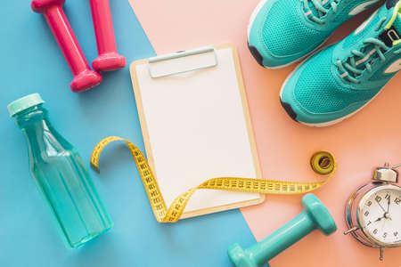 workout composition with clipboard fitness tools. High quality beautiful photo conceptの写真素材