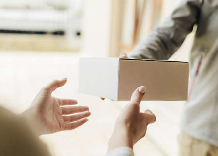 close up hands getting box. High quality beautiful photo conceptの写真素材