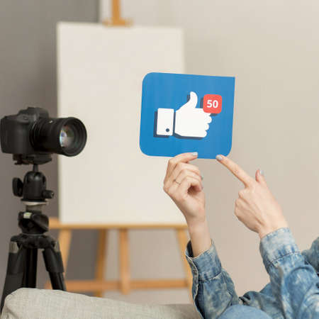 close up woman holding like button. High quality beautiful photo conceptの写真素材