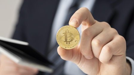 businessman holding bitcoin close up. High quality beautiful photo conceptの写真素材