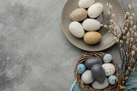 top view colored easter eggs basket plate with copy space. High quality beautiful photo conceptの写真素材