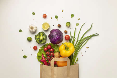 Photo Top view of assortment of vegetables in paper bag. High quality beautiful photo conceptの写真素材