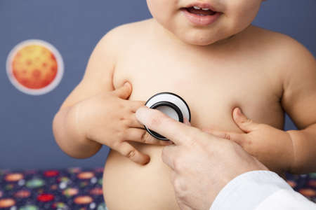 close up baby examination with stethoscope. High quality beautiful photo conceptの写真素材