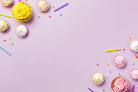 muffins candles aalaw sprinkles corner pink background. High quality beautiful photo conceptの写真素材