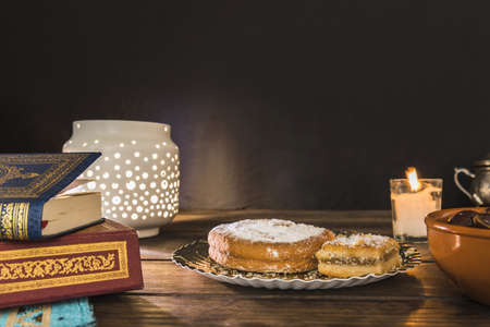 pastry near books lantern. High quality beautiful photo conceptの写真素材