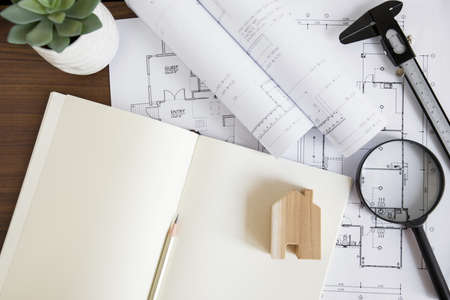 notepad house figure near schemes. High quality beautiful photo concept
