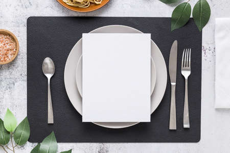 top view blank menu paper plate with cutlery leaves. High quality beautiful photo conceptの写真素材