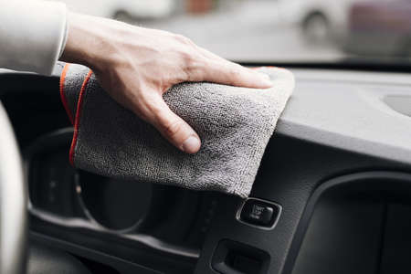 close up person cleaning car interior. High quality beautiful photo concept