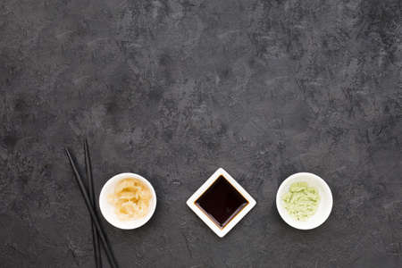 overhead view marinated ginger wasabi soya sauce with chopstick blackboard. High quality beautiful...