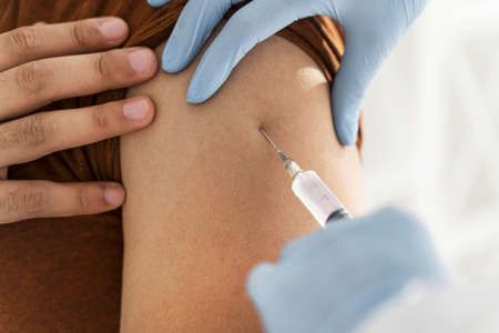 close up man being vaccinating by doctor. High quality beautiful photo conceptの写真素材