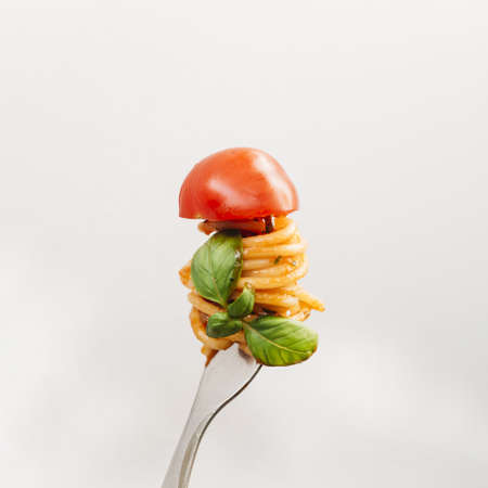 tasty spaghetti wrapped around fork. High quality beautiful photo conceptの写真素材