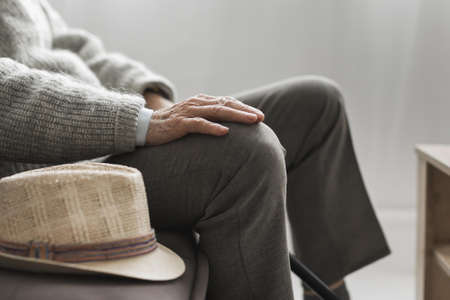 side view man with his hat in nursing home.の写真素材