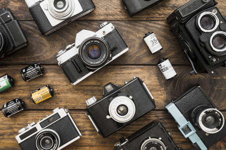 small film cartridges amidst cameras.の写真素材