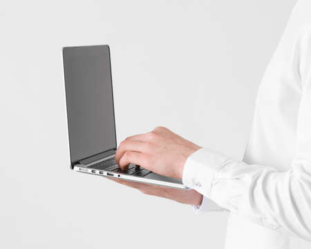 close up hands typing laptop