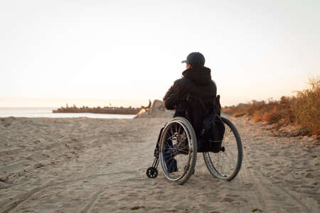 full shot disabled man beachの写真素材