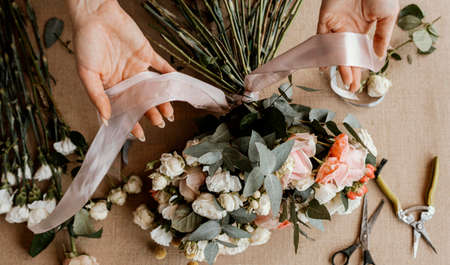 woman making beautiful floral bouquet. High quality photo